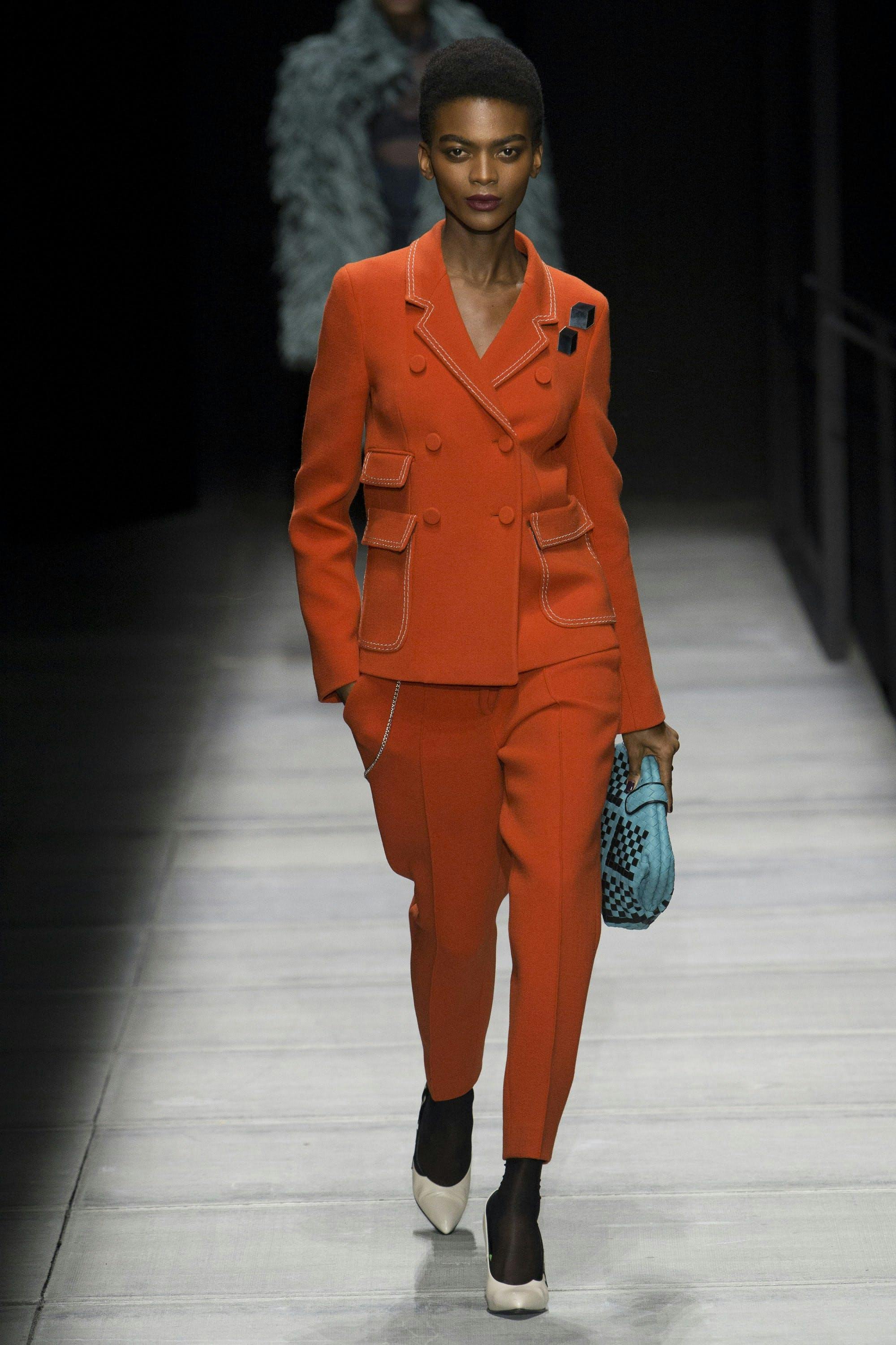 coat clothing apparel person human suit overcoat runway