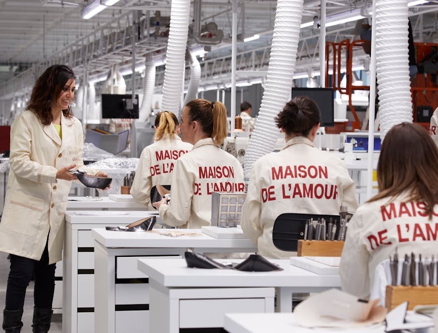 person human coat clothing apparel building factory
