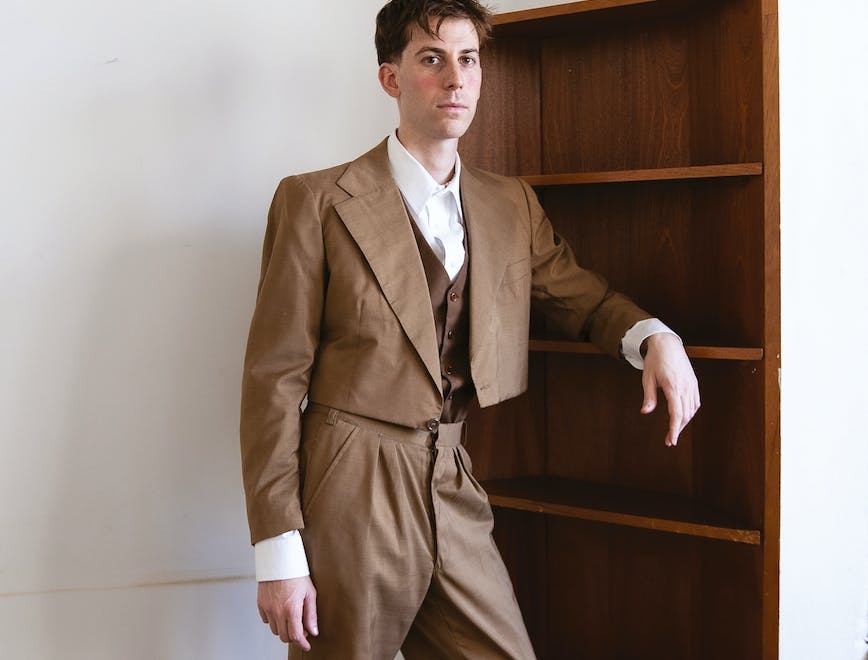 formal wear suit coat hardwood wood adult male man person shoe