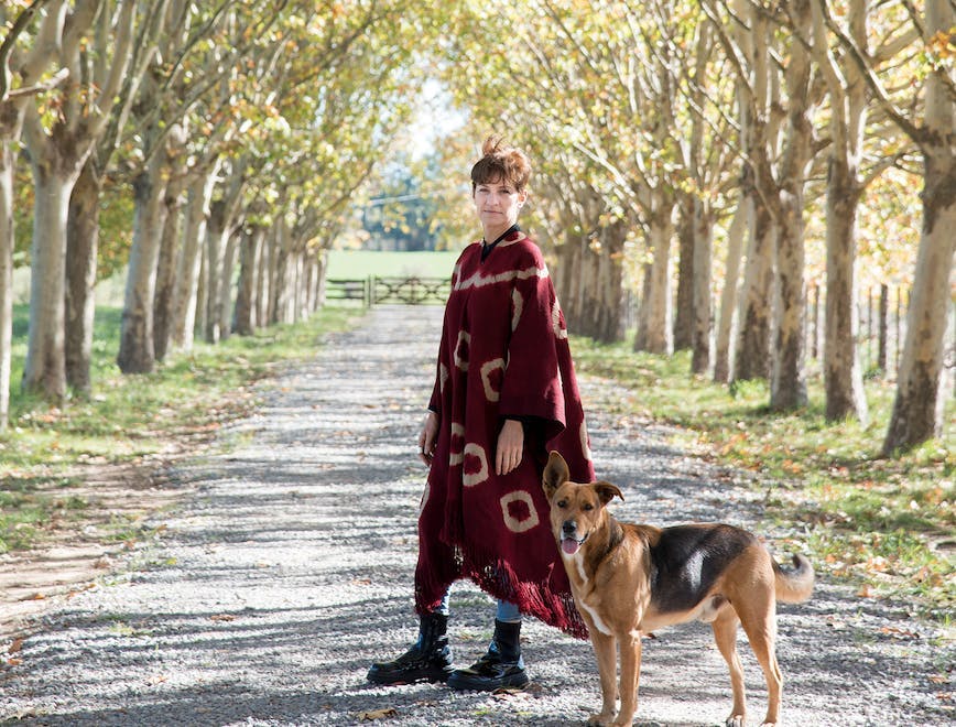 fashion clothing coat person walking plant tree dog pet dress