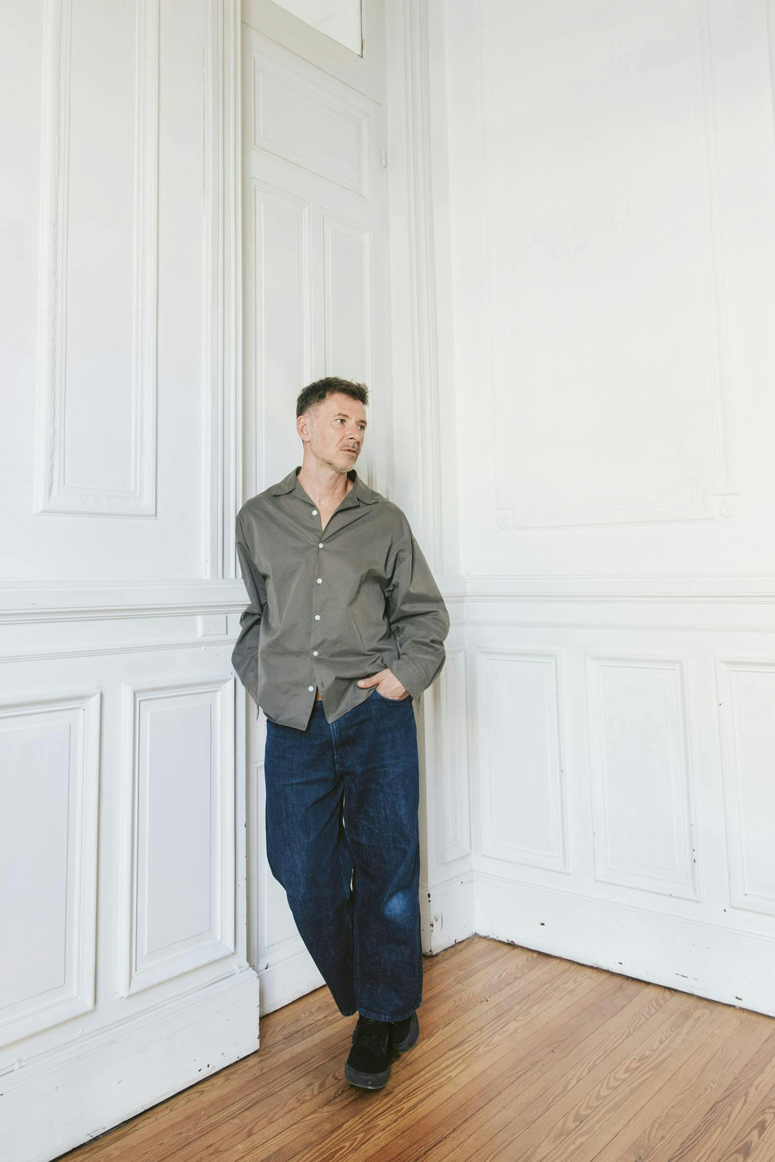 pants jeans wood adult male man person floor flooring shirt